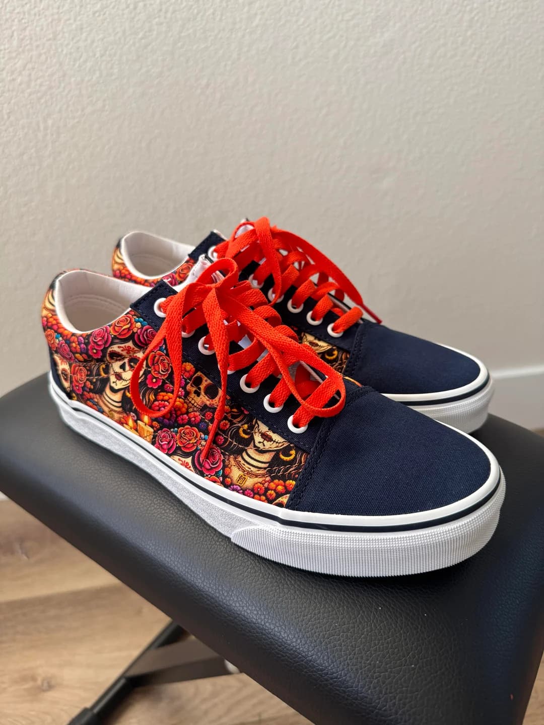 Side profile of the custom Padres Día de los Muertos Vans showing the SD logo and sugar-skull print